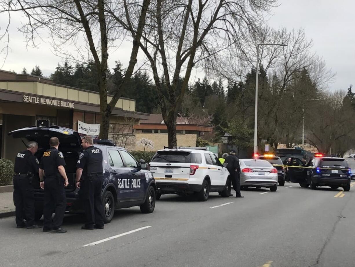 Seattle police work at the scene of a shooting in Seattle on Wednesday, March 27, 2019. Four people including a metro bus driver were shot Wednesday afternoon, and one person has been detained, police said.