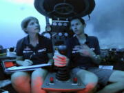 An image taken from video issued by Nekton shows Lucy Woodall, Nekton Mission principle scientist, left, alongside pilot Randy Holt inside a submersible 60 metres below surface of Indian Ocean during a descent into the Indian Ocean off Alphonse Atoll near the Seychelles, Tuesday March 12, 2019. Members of the British-led Nekton research team boarded two submersible vessels and descended into the waters off the Seychelles on Tuesday, marking a defining moment in their mission to document changes to the Indian Ocean. The submersibles will be battling strong undersea currents and potentially challenging weather conditions as they survey the side of an undersea mountain off Alphonse Atoll.