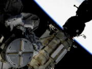 This image provided by NASA shows astronauts Anne McClain and Nick Hague taking a spacewalk to replace aging batteries on the International Space Station on Friday, March 22, 2019. Friday’s spacewalk is the first of three planned excursions to replace batteries and perform other maintenance.