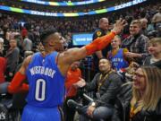 Oklahoma City Thunder guard Russell Westbrook (0) waves to the crowd as he leaves the court following an NBA basketball game against the Utah Jazz, on Monday, March 11, 2019, in Salt Lake City.