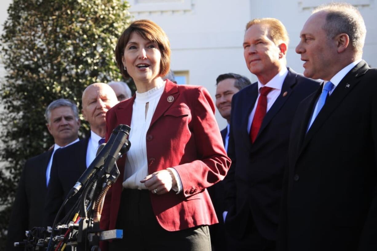 Rep. Cathy McMorris Rodgers, R-Wa., together with Rep. Kevin Brady, R-Texas, left, Rep. Rep. Steve Scalise, R-La., right, Rep. Vern Buchanan, R-Fla., second from right, and other Republican members of Congress speaks to reporters outside the West Wing of the White House following a meeting with President Donald Trump at the White House in Washington, Tuesday, March 26, 2019.