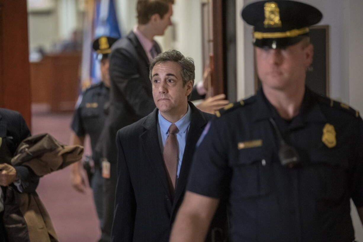 Michael Cohen departs the Capitol on Wednesday after appearing before the House Intelligence Committee. j.