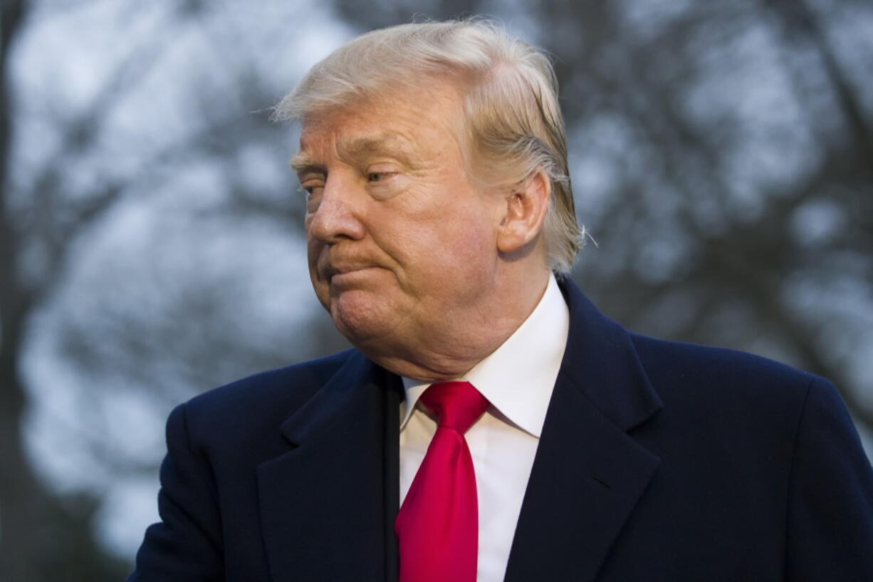 President Donald Trump turns to depart after speaking with the media after stepping off Marine One on the South Lawn of the White House, Sunday, March 24, 2019, in Washington. The Justice Department said Sunday that special counsel Robert Mueller’s investigation did not find evidence that President Donald Trump’s campaign “conspired or coordinated” with Russia to influence the 2016 presidential election.