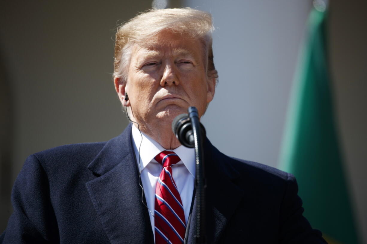 President Donald Trump listens to Brazilian President Jair Bolsonaro speak during a news conference in the Rose Garden of the White House, Tuesday, March 19, 2019, in Washington.