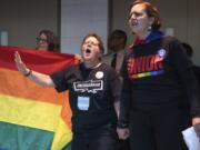 People objecting to the adoption of the Traditional Plan protest Tuesday outside the United Methodist Church’s 2019 Special Session of the General Conference in St. Louis, Mo.