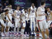 Gonzaga players celebrate as they lead Pepperdine with seconds left in the second half of an NCAA semifinal college basketball game at the West Coast Conference tournament, Monday, March 11, 2019, in Las Vegas.