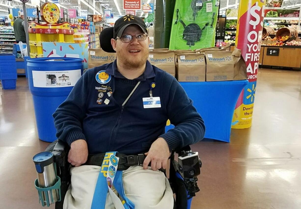 Walmart greeter John Combs works at a Walmart store in Vancouver.