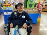 Walmart greeter John Combs works at a Walmart store in Vancouver.