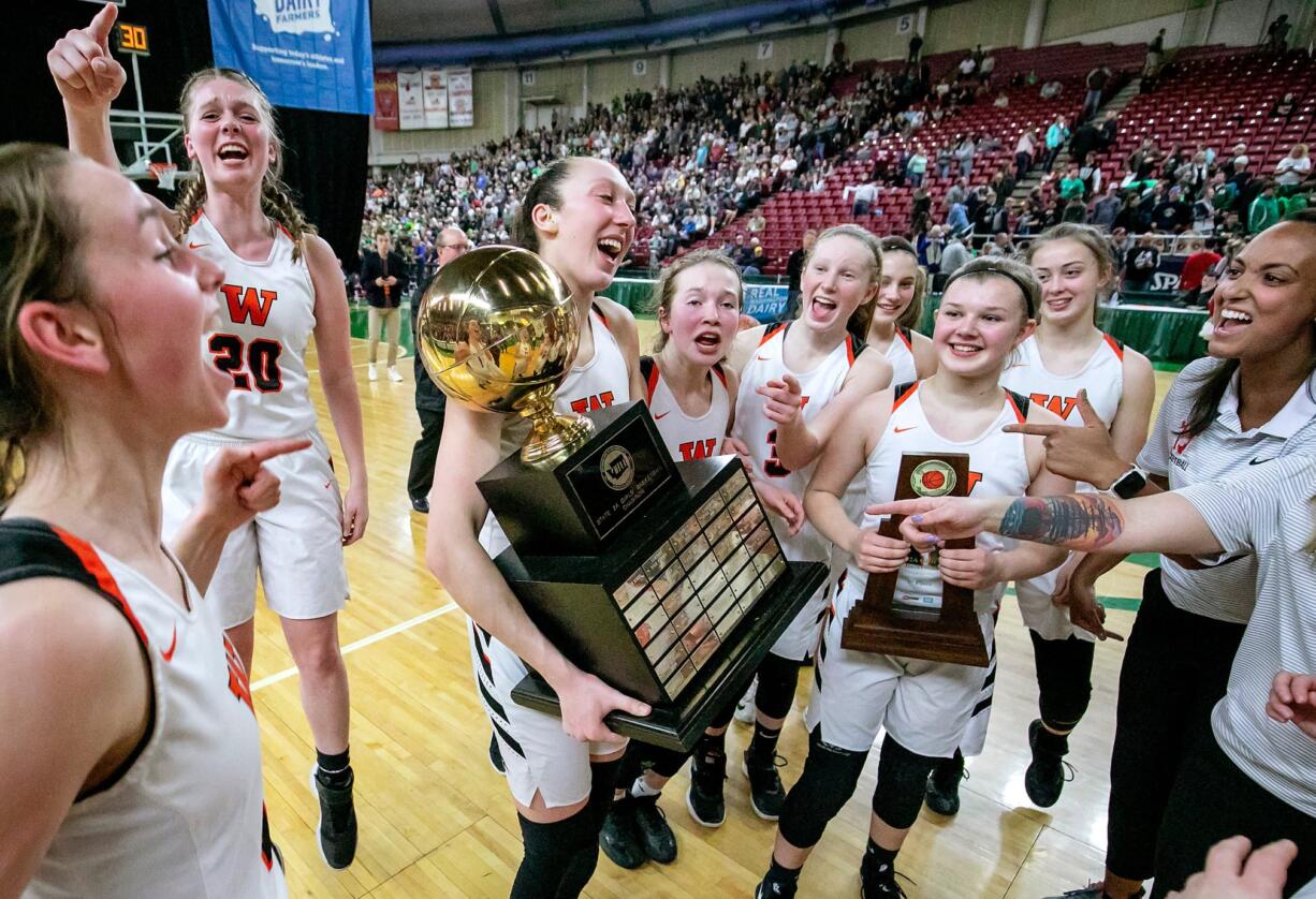 Washougal celebrates after winning the WIAA 2A girls state basketball championship over East Valley (Spokane), on Saturday, Mar. 2, 2019, at the Yakima Valley SunDome. Washougal Panthers defeated against the East Valley (Spokane) Knights in overtime 49-40.