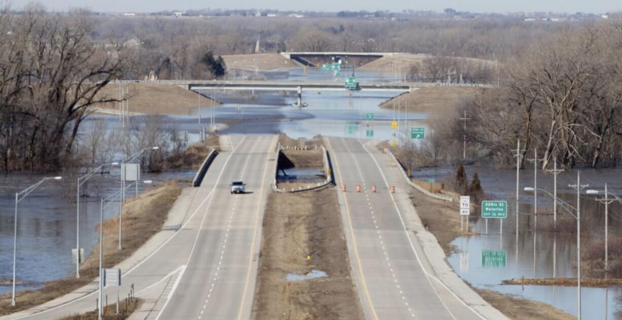 Dodge street is closed from flood waters on Saturday March 16, 2019 in Omaha Neb. The flooding followed days of snow and rain — record-setting, in some places — that swept through the West and Midwest The elkhorn river bridge is the first bridge.