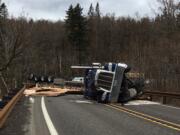 State Highway 14 at milepost 23 was closed Wednesday due to a semi rollover. The semi lost its load of plywood and blocked all lanes of traffic, according to WSP.