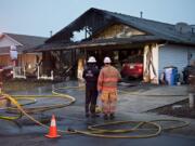 Officials investigate after a fast-moving fire destroyed a home March 6 in the Five Corners area of Vancouver. A relative said a family of six lost their home and their belongings in the blaze. The Clark County Fire Marshal’s Office has determined the fire started from damaged electrical wiring.