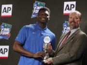 Duke freshman Zion Williamson, left, is presented The Associated Press College Basketball Coach of the Year Award, was named the John R. Wooden Women’s Player of the year at the College Basketball Awards ceremony in Los Angeles, Friday, April 12, 2019.