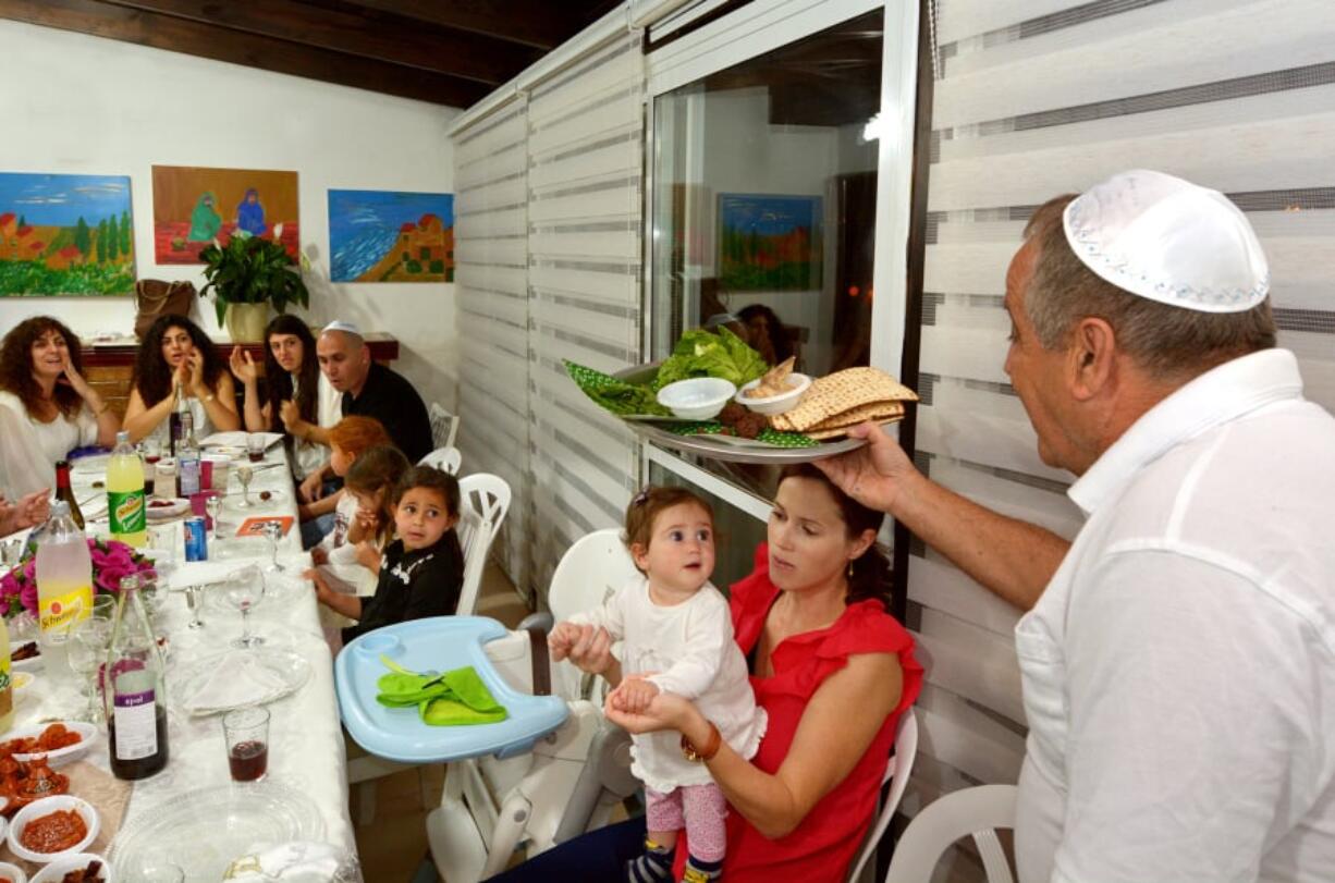 In April 2015, a Jewish family celebrates Passover Seder in Jerusalem. It’s a Jewish ritual feast involving a retelling of the story of liberation of the Israelites from slavery in ancient Egypt 3,500 years ago.