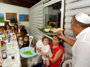 In April 2015, a Jewish family celebrates Passover Seder in Jerusalem. It’s a Jewish ritual feast involving a retelling of the story of liberation of the Israelites from slavery in ancient Egypt 3,500 years ago.