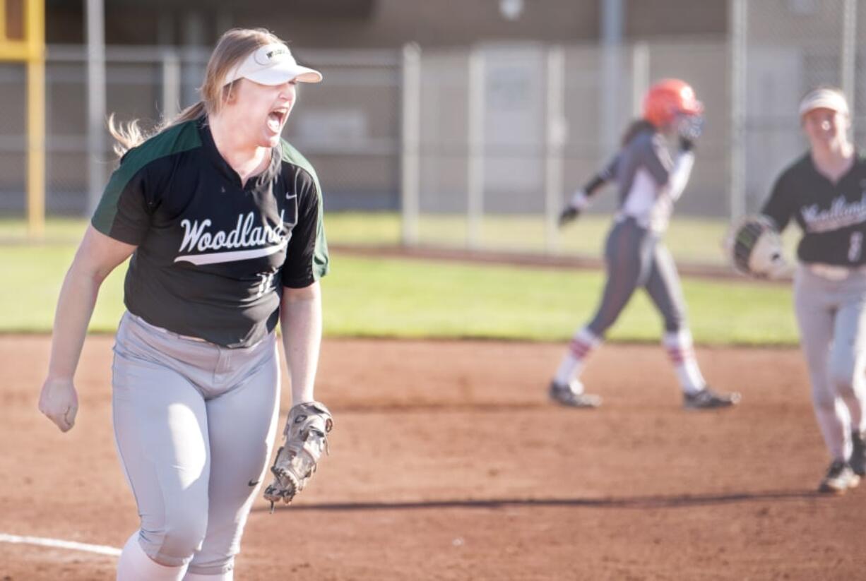 Woodland pitcher Olivia Grey lets out a roar after striking out her 16th batter to end a 2A Greater St. Helens League softball game on Wednesday in Woodland. The Beavers won 4-0 over Ridgefield.