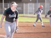 Woodland pitcher Olivia Grey lets out a roar after striking out her 16th batter to end a 2A Greater St. Helens League softball game on Wednesday in Woodland. The Beavers won 4-0 over Ridgefield.