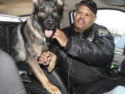 Philadelphia police Officer Alvin Outlaw and his K-9 partner, Thor, on Feb. 14, 2014. Thor is losing the use of his back legs and will soon receive a wheelchair.