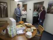 The accounting team greets members of the newsroom during an open house at The Columbian in Vancouver on Tuesday.