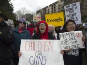 Lindsey Luis, at center, marches at the 2018 March for Our Lives, a nationwide string of student-led demonstrations following the death of 17 students and staff members at Marjory Stoneman Douglas High School in Parkland, Fla.