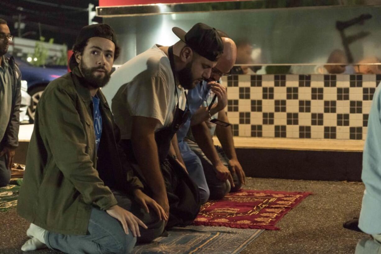 Ramy (Ramy Youssef), left, alongside his friends Mo (Mohammed Amer), and Ahmed (Dave Merheje), makes an earnest effort to reconcile his Muslim faith with the everyday temptations of secular life in Hulu’s “Ramy.” Barbara Nitke/Hulu