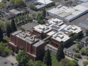 An aerial view of the Clark County Courthouse, front, and Clark County Jail behind it in downtown Vancouver.