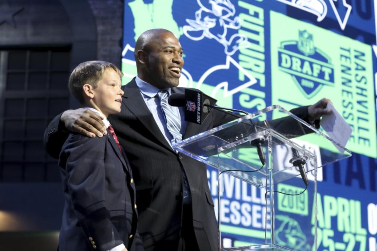 Owen Church, childhood cancer survivor announces the Seattle Seahawks second round pick with Seahawks legend Shaun Alexander during the second round of the NFL football draft, in Nashville, Tenn. on Friday, April 26, 2019.