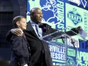 Owen Church, childhood cancer survivor announces the Seattle Seahawks second round pick with Seahawks legend Shaun Alexander during the second round of the NFL football draft, in Nashville, Tenn. on Friday, April 26, 2019.