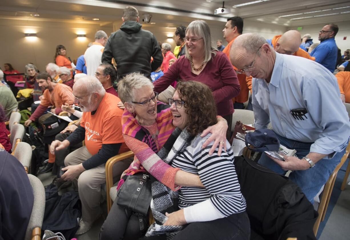 Linda Garcia, front and center, celebrates after Washington’s Energy Facility Site Evaluation Council rejected the Port of Vancouver oil terminal at the John A. Cherberg Building in Olympia on Nov. 28, 2017. Garcia was one of six people worldwide to receive the Goldman Environmental Prize for her work blocking the terminal.