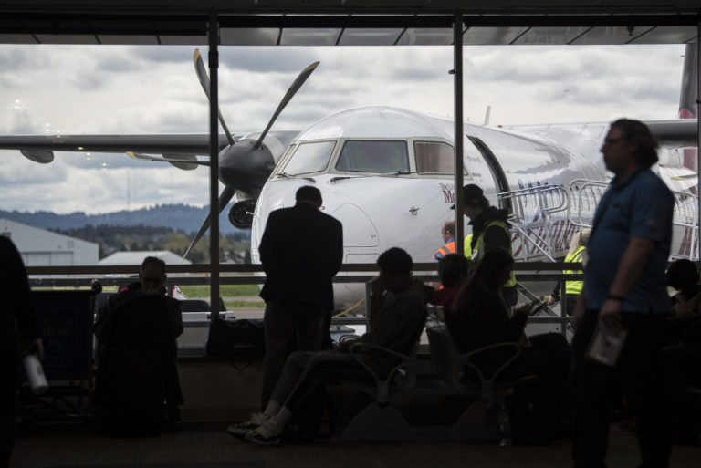 Passengers wait at a gate in Concourse A, which will be demolished starting this fall as part of a project to remodel and expand Concourse B.