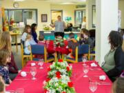 Woodland: Laura Perry, head of Nutrition Services for Woodland Public Schools, talking to students and parents about table manners prior to a fine-dining event at Woodland Intermediate School.