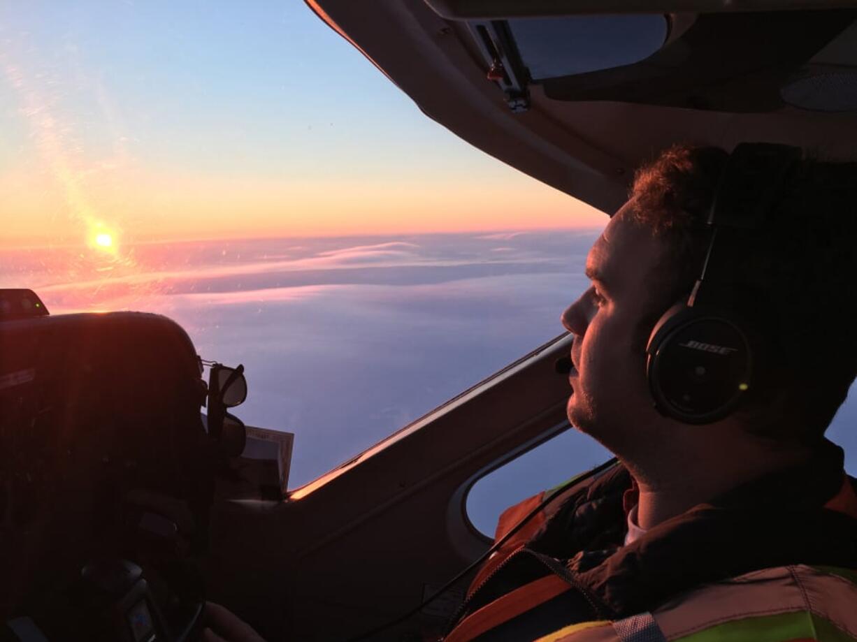 Sam T. James flying in Alaska during his employment at Ravn Alaska, a commercial airline that serves small Alaskan villages.