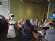 A robot delivers the lunch order for a customer at the new Big Town Hero in downtown Vancouver. The sandwich shop, which opened Thursday, is one of 14 locations in Oregon and Washington.