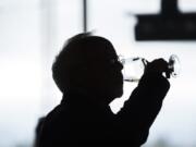 Steve Johnson of Washougal sips wine during the industry preview of the Maryhill Winery tasting room at the Waterfront Vancouver. The 5,000 square foot tasting room can host up to 300 guests inside and on the outdoor patio, and co-owner Craig Leuthold expected it to be full all weekend.