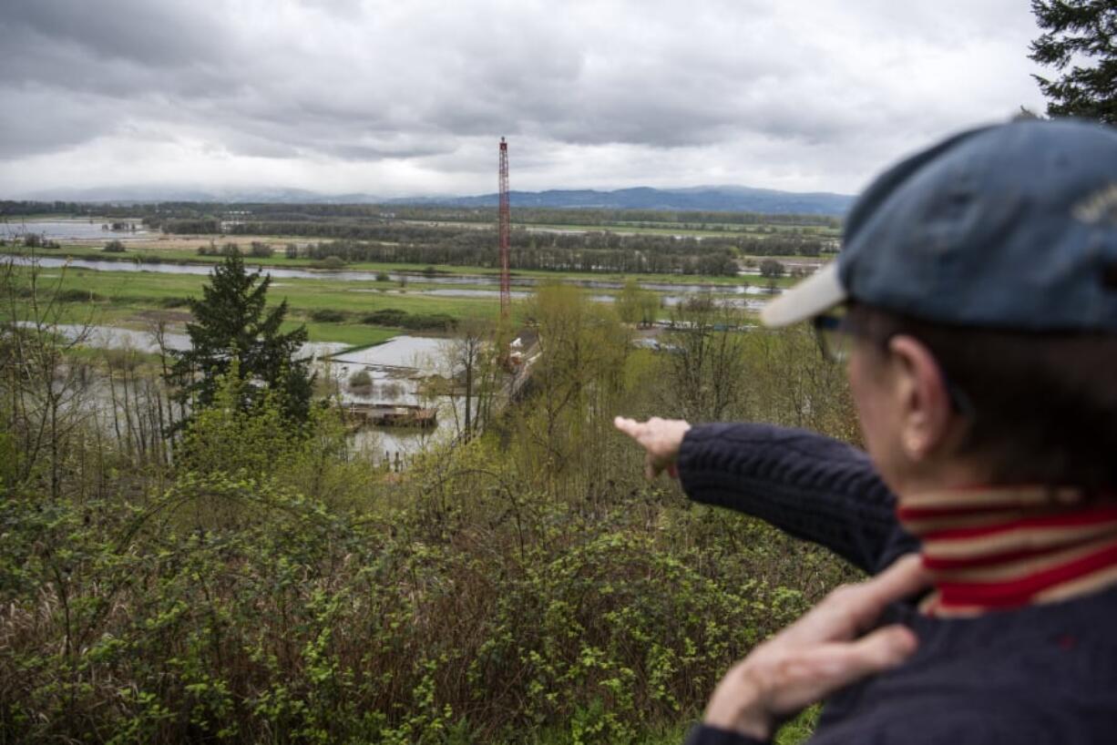 Ellen Smart identifies the starting point of the replacement bridge that will cross over Lake River to the River ‘S’ unit of the Ridgefield National Wildlife Refuge, a plan that has been in the works for more than a decade. Construction started in mid-March and is expected to last until sometime in spring 2020.