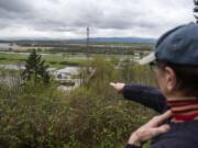 Ellen Smart identifies the starting point of the replacement bridge that will cross over Lake River to the River ‘S’ unit of the Ridgefield National Wildlife Refuge, a plan that has been in the works for more than a decade. Construction started in mid-March and is expected to last until sometime in spring 2020.