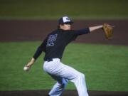 Lowell Dunmire pitches against a Heritage batter at Propstra Stadium on Thursday evening, April 11, 2019.