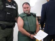 Randy John Schmidt, 47, appears Wednesday, April 10, 2019, in Clark County Superior Court to face an allegation of second-degree murder in the death of 52-year-old Michael Chad Holmes of Camas.