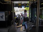 Carolyn Hayden of Vancouver chats with the bus driver as she boards C-Tran’s Route 39 on Thursday. Hayden is a veteran and she said she uses the route often to get to the VA Portland Health Care System Vancouver Campus. She routinely bakes bread for C-Tran staff, but she says she’ll stop if Route 39 is eliminated.