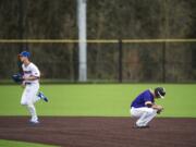 Columbia River's Cole Delich reacts to being called out at Second Base during a game against Ridgefield at the Ridgefield Outdoor Recreation Center on Tuesday night, April 16, 2019.