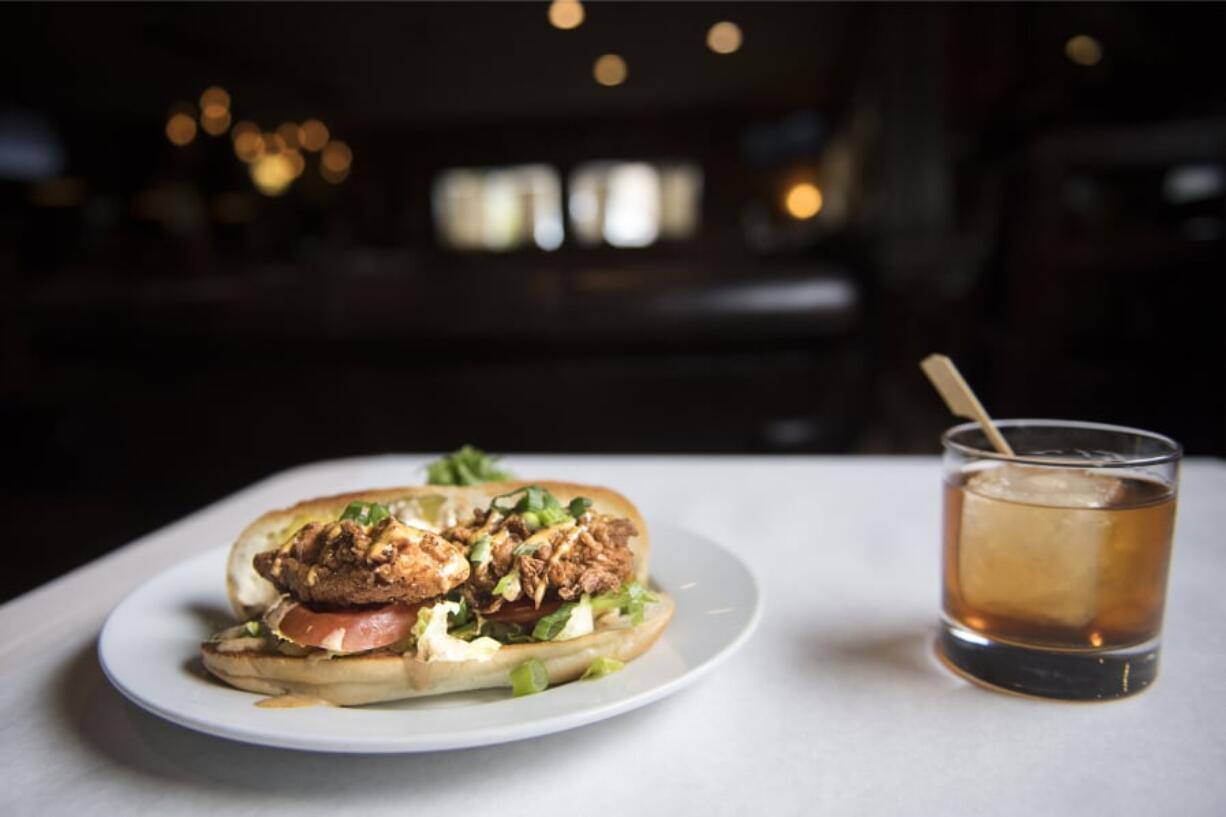 The po’ boy sandwich and an Old Fashioned at Frontier Public House.