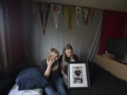 Sharyn Little wipes away a tear as she looks at a photo of her son Michael Little, who at 17 died of cancer last fall. Her daughter, Lauren, joined her in his bedroom Thursday morning. Michael was a senior at Hudson’s Bay High School when he died in October. He will participate posthumously in Mr. and Ms. Hudson’s Bay, a mock beauty pageant to raise money for Doernbecher Children’s Hospital.