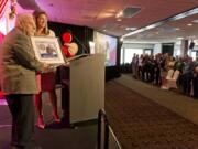 Ed Barnes, 2019 Clark County First Citizen, is honored at WareHouse '23 by Jennifer Rhoads, president of the Community Foundation for Southwest Washington. Photo by James Rexroad for The Columbian.