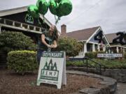 Morgan Hutchinson, co-owner of High End Market Place, prepares the marijuana dispensary for the upcoming 420 celebration, held every year on April 20. This year, High End will also celebrate becoming a Clark County-certified Green Business.