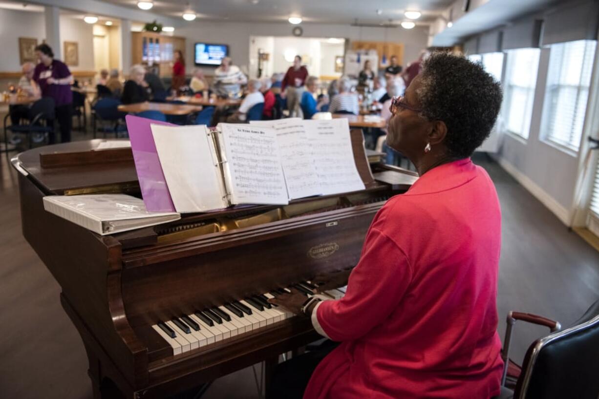 Yvonne Payne performs for an afternoon happy hour at Glenwood Place Senior Living in Vancouver. Residents gathered to drink wine and listen to Payne play in the background. The 73-year-old has been a working pianist since she was in her teens. “I think it’s just a matter of persistence,” she said of her career.