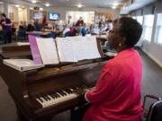 Yvonne Payne performs for an afternoon happy hour at Glenwood Place Senior Living in Vancouver. Residents gathered to drink wine and listen to Payne play in the background. The 73-year-old has been a working pianist since she was in her teens. “I think it’s just a matter of persistence,” she said of her career.