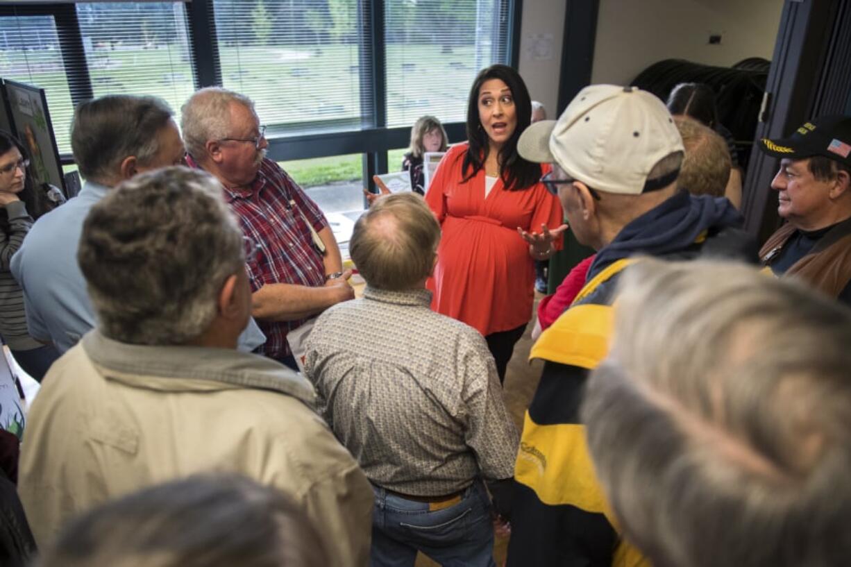 Rep. Jaime Herrera Beutler, R-Battle Ground, center, answers questions from a crowd that met her at the door during the Southwest Washington Senior Resource Fair at the Luepke Center on Tuesday afternoon. While not a partisan event, the conversation veered into a wide array political topics.