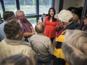 Rep. Jaime Herrera Beutler, R-Battle Ground, center, answers questions from a crowd that met her at the door during the Southwest Washington Senior Resource Fair at the Luepke Center on Tuesday afternoon. While not a partisan event, the conversation veered into a wide array political topics.