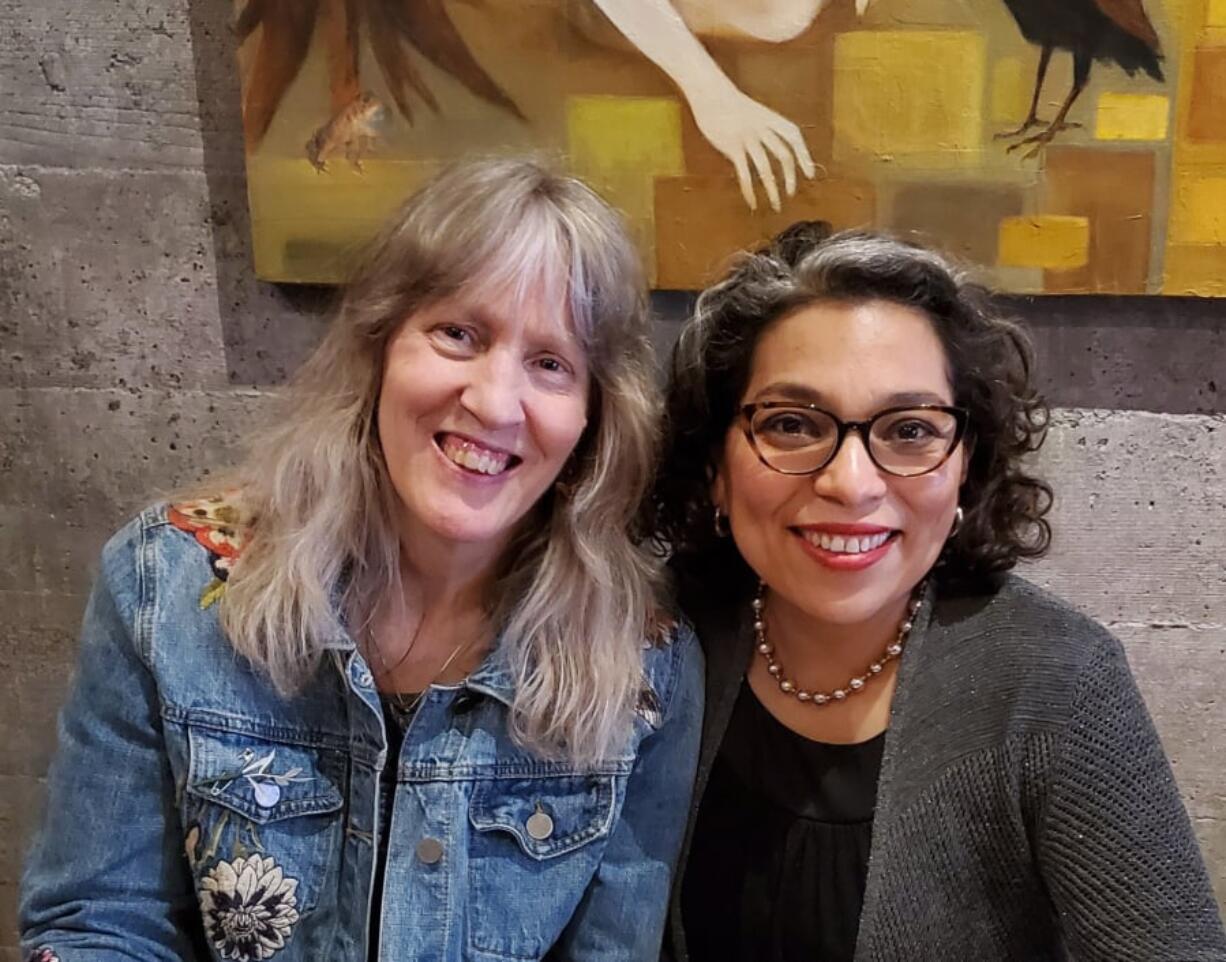 A pair of poet laureates: Gwendolyn Morgan, left, is the poet laureate of Clark County and Claudia Castro Luna is the poet laureate of Washington state. They met at Niche Wine Bar when Castro Luna visited Vancouver earlier this month. Castro Luna was recently awarded a $100,000 grant to conduct poetry readings and workshops along the Columbia River, highlighting its importance.