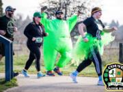 Esther Short: Matthew Dalimata dressed as a green sumo wrestler, one of the many costumed racers in the fifth annual Couve Clover Run, which raised more than $6,000 for local charities.